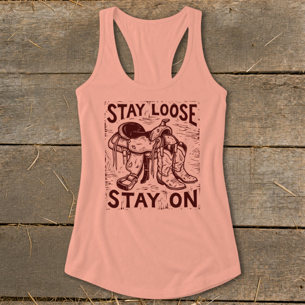 Tank top with graphic of saddle and boots, reading "STAY LOOSE STAY ON".