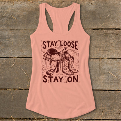 Tank top with graphic of saddle and boots, reading "STAY LOOSE STAY ON".