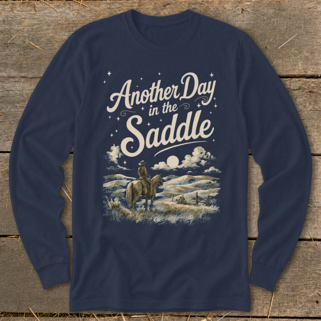 Navy long sleeve shirt with "Another Day in the Saddle" text and cowboy on horse graphic.