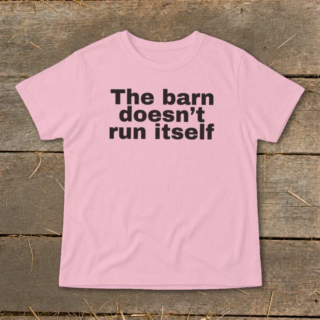 Pink t-shirt with black text reading "The barn doesn't run itself".