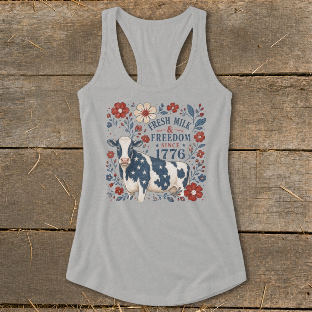 Tank top with cow, flowers, and text "Fresh Milk & Freedom Since 1776".