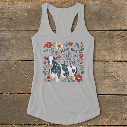 Tank top with cow, flowers, and text "Fresh Milk & Freedom Since 1776".