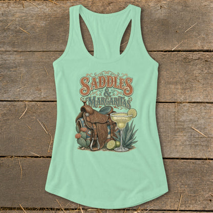 Mint green tank top with "Saddles & Margaritas" graphic and western elements.