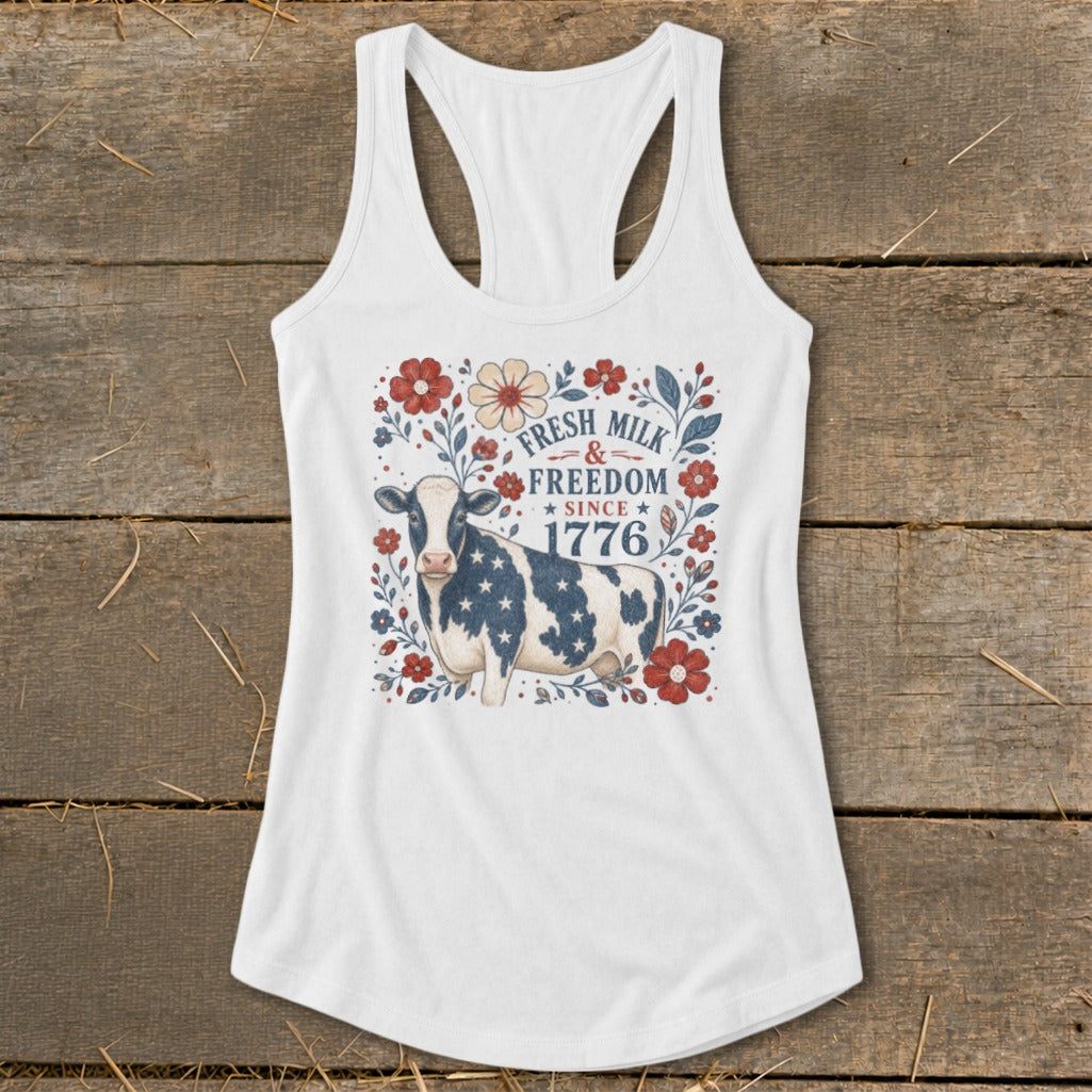 White tank top with cow and patriotic text "Fresh Milk & Freedom Since 1776".