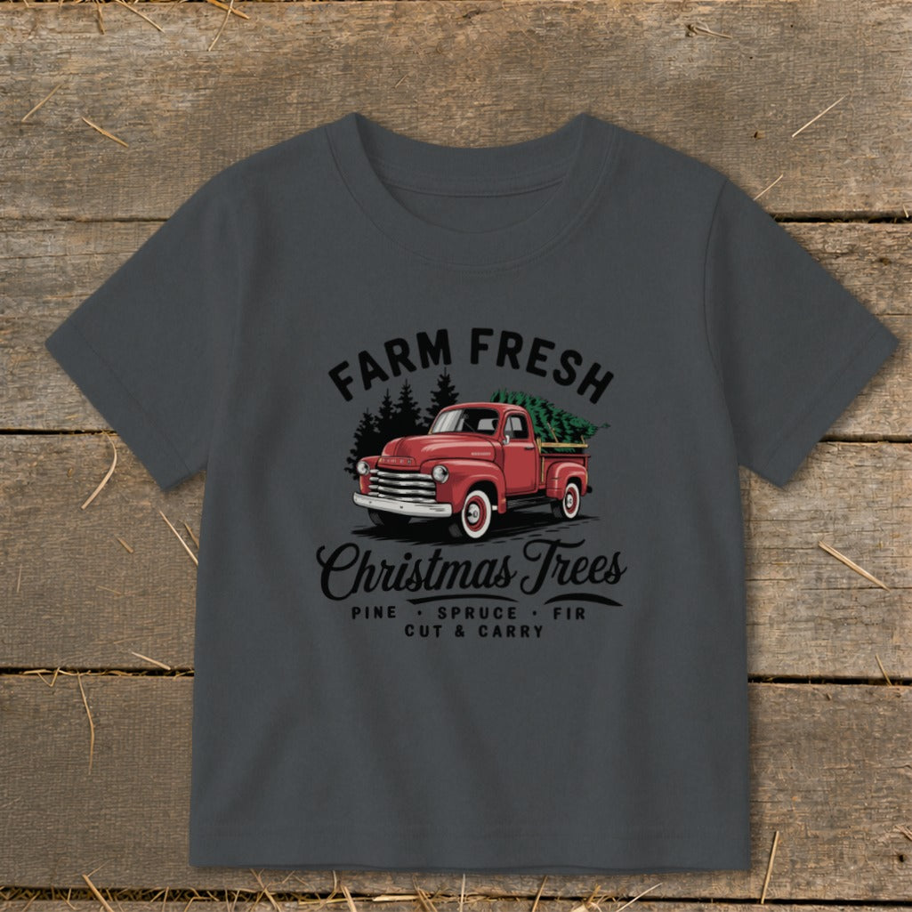 Farm Fresh Christmas Trees graphic on a dark grey t-shirt with red truck.