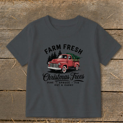 Farm Fresh Christmas Trees graphic on a dark grey t-shirt with red truck.