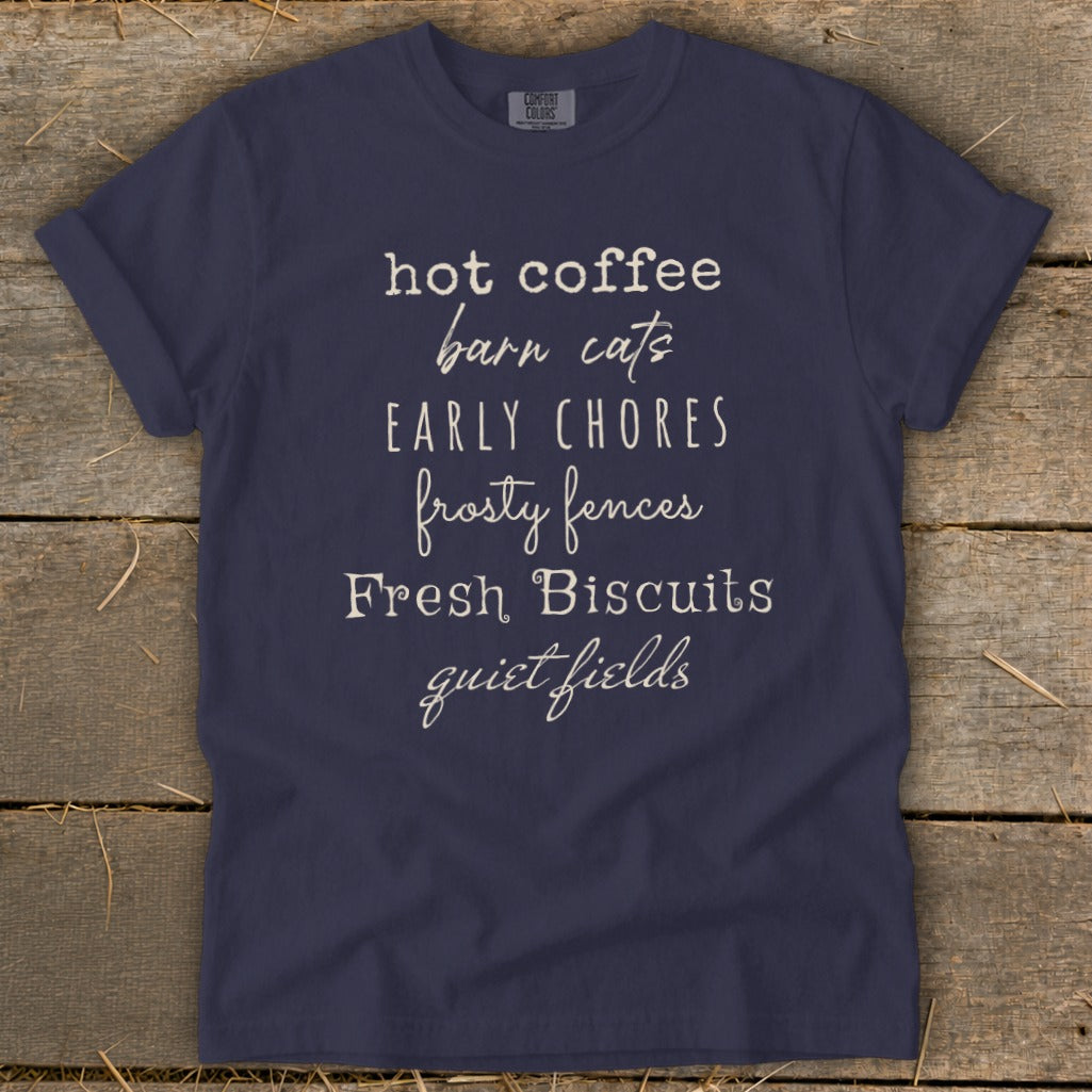 Navy t-shirt with "hot coffee barn cats EARLY CHORES frosty fences Fresh Biscuits quiet fields" text.
