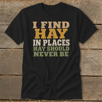 Black t-shirt with "I FIND HAY IN PLACES HAY SHOULD NEVER BE" text.