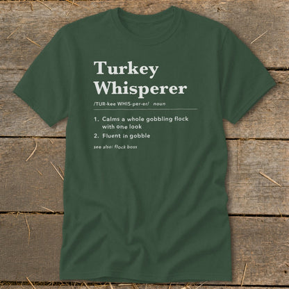 Green t-shirt with "Turkey Whisperer" definition: calms flock, fluent in gobble.