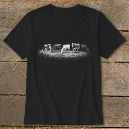 Black v-neck t-shirt with a line of five cows grazing in a field.