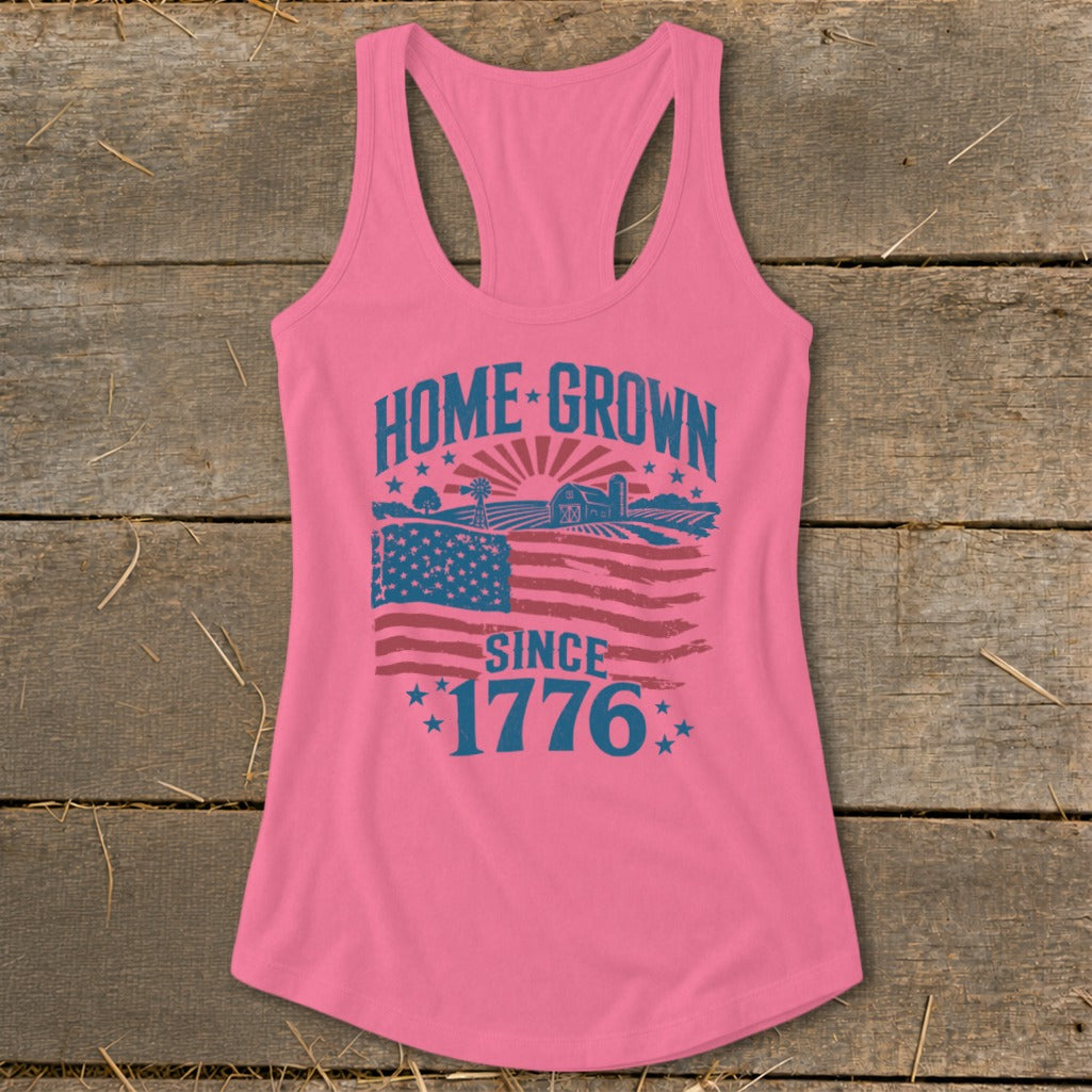Pink tank top with "HOME GROWN SINCE 1776" text and American flag graphic.