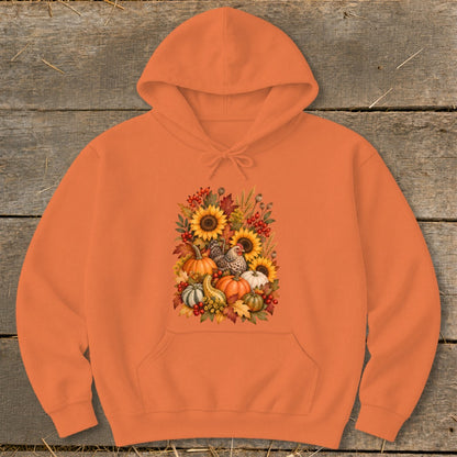 Orange hoodie with a fall harvest graphic featuring pumpkins, sunflowers, chickens, and gourds.