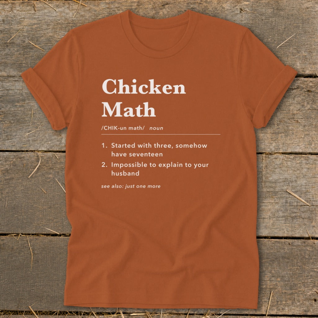 Orange t-shirt with "Chicken Math" definition and humorous bullet points about chickens.