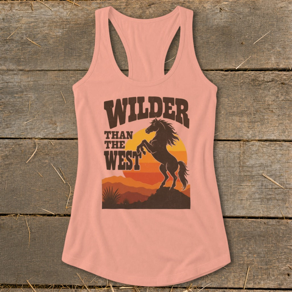 Peach tank top with "Wilder Than The West" text and a rearing horse graphic.