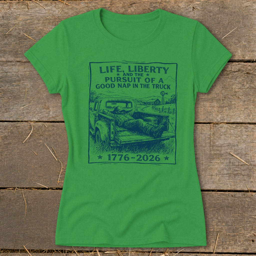 Green t-shirt with blue graphic: "Life, Liberty and the pursuit of a good nap in the truck 1776-2026".