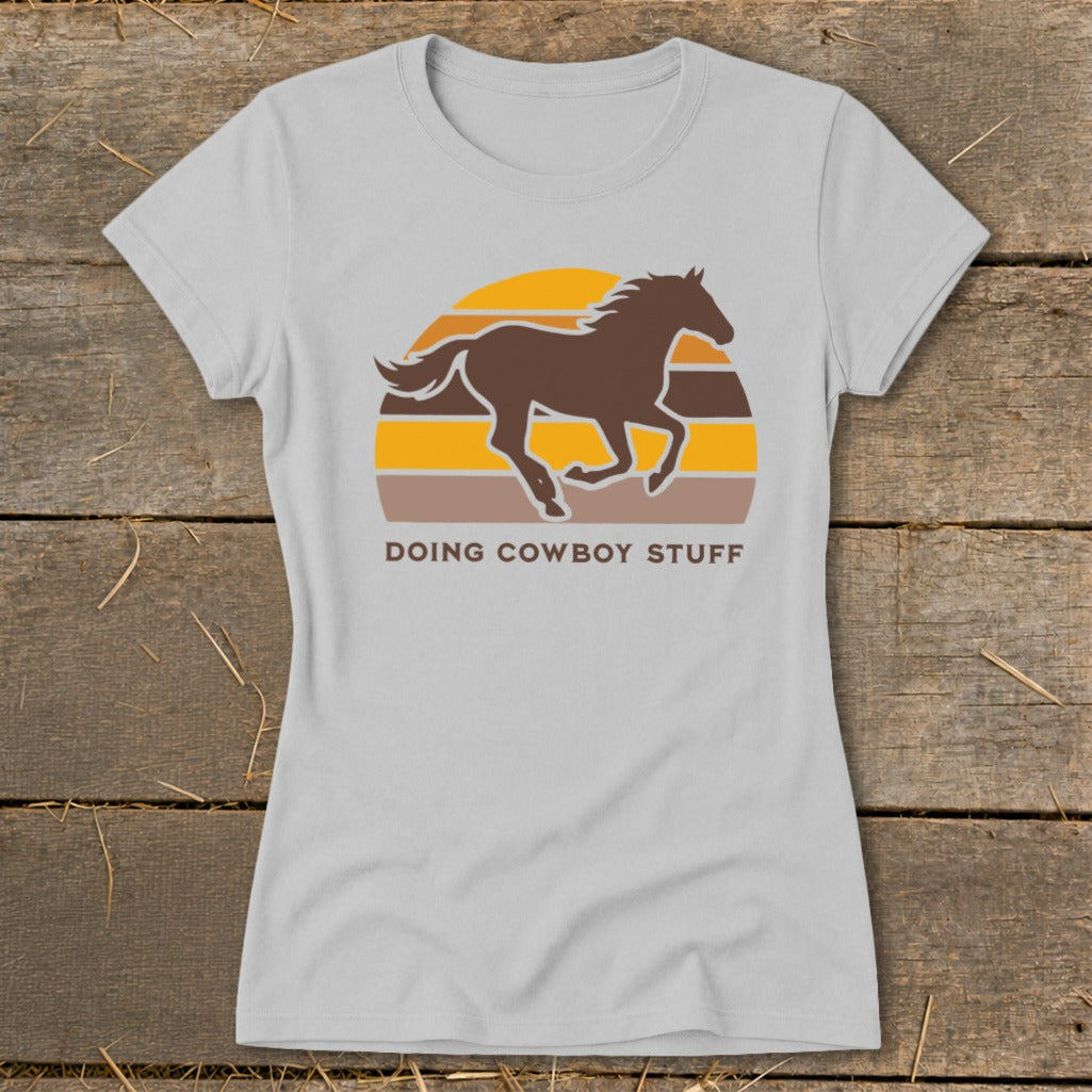 Grey t-shirt with brown running horse graphic and text "DOING COWBOY STUFF".
