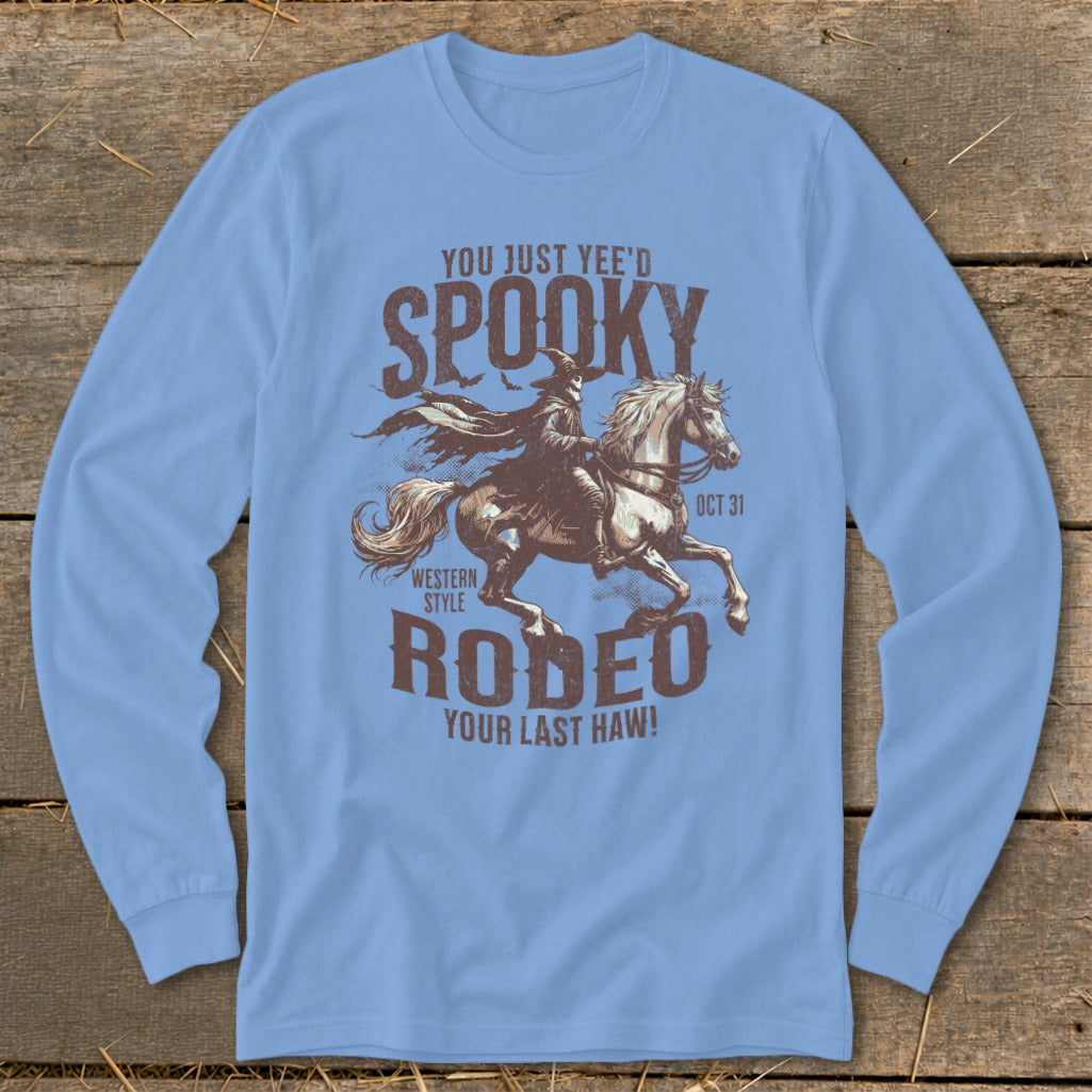 Light blue long-sleeve shirt with "Spooky Rodeo" graphic featuring a cowboy on a horse.