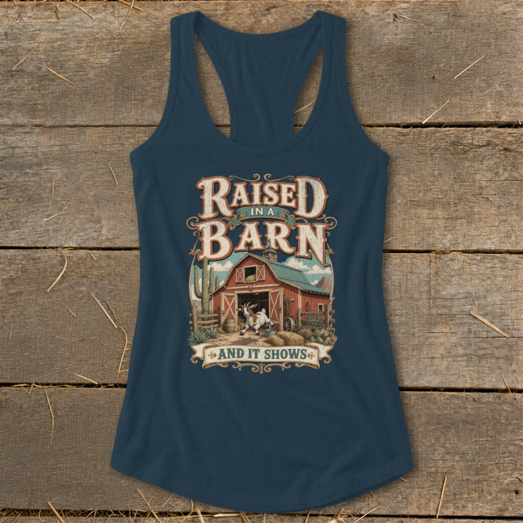 Dark blue tank top with "Raised in a Barn and it Shows" text and barn graphic.