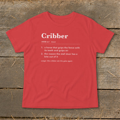 Red t-shirt featuring a dictionary definition graphic for the word Cribber printed in white on the front.