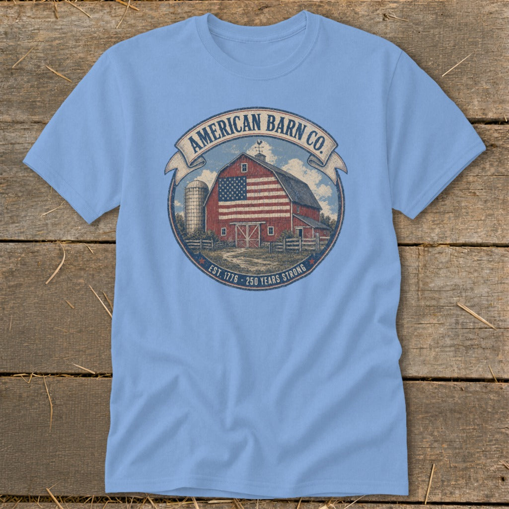 Light blue t-shirt with American Barn Co. logo: red barn with US flag design, silo, text.