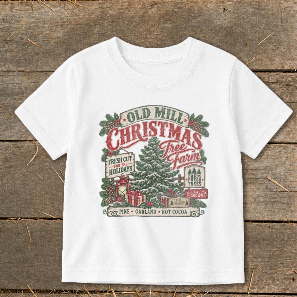 White t-shirt with Old Mill Christmas Tree Farm graphic featuring a tree, gifts, and signs.
