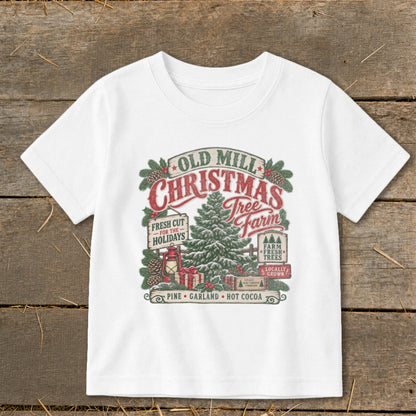 White t-shirt with Old Mill Christmas Tree Farm graphic featuring a tree, gifts, and signs.