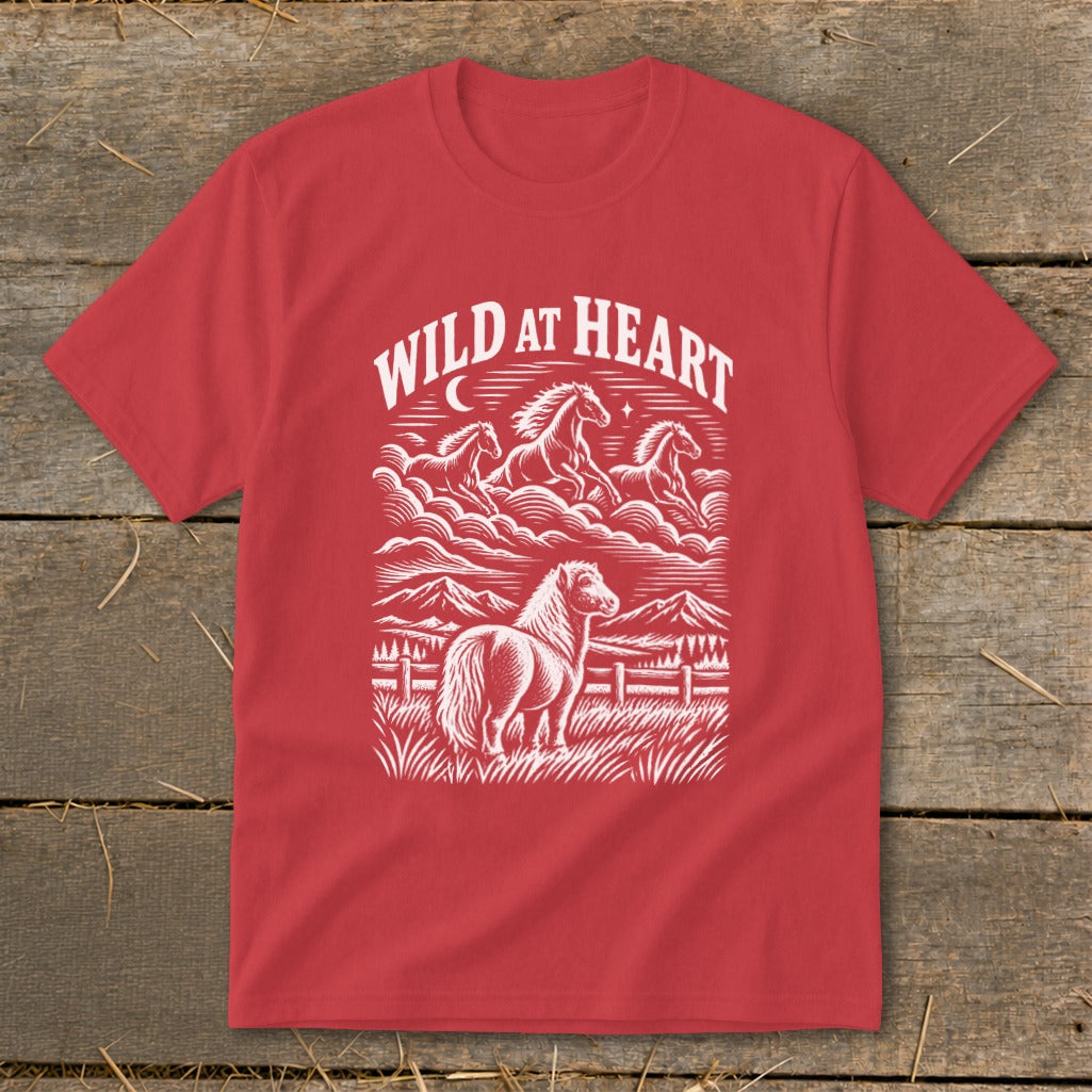 Red t-shirt with "Wild at Heart" graphic of horses in the sky and on the ground.