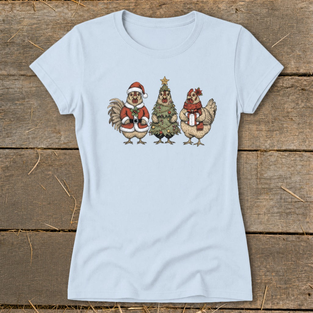 Light blue t-shirt with illustration of a rooster in Santa suit, Christmas tree, and hen with gift.