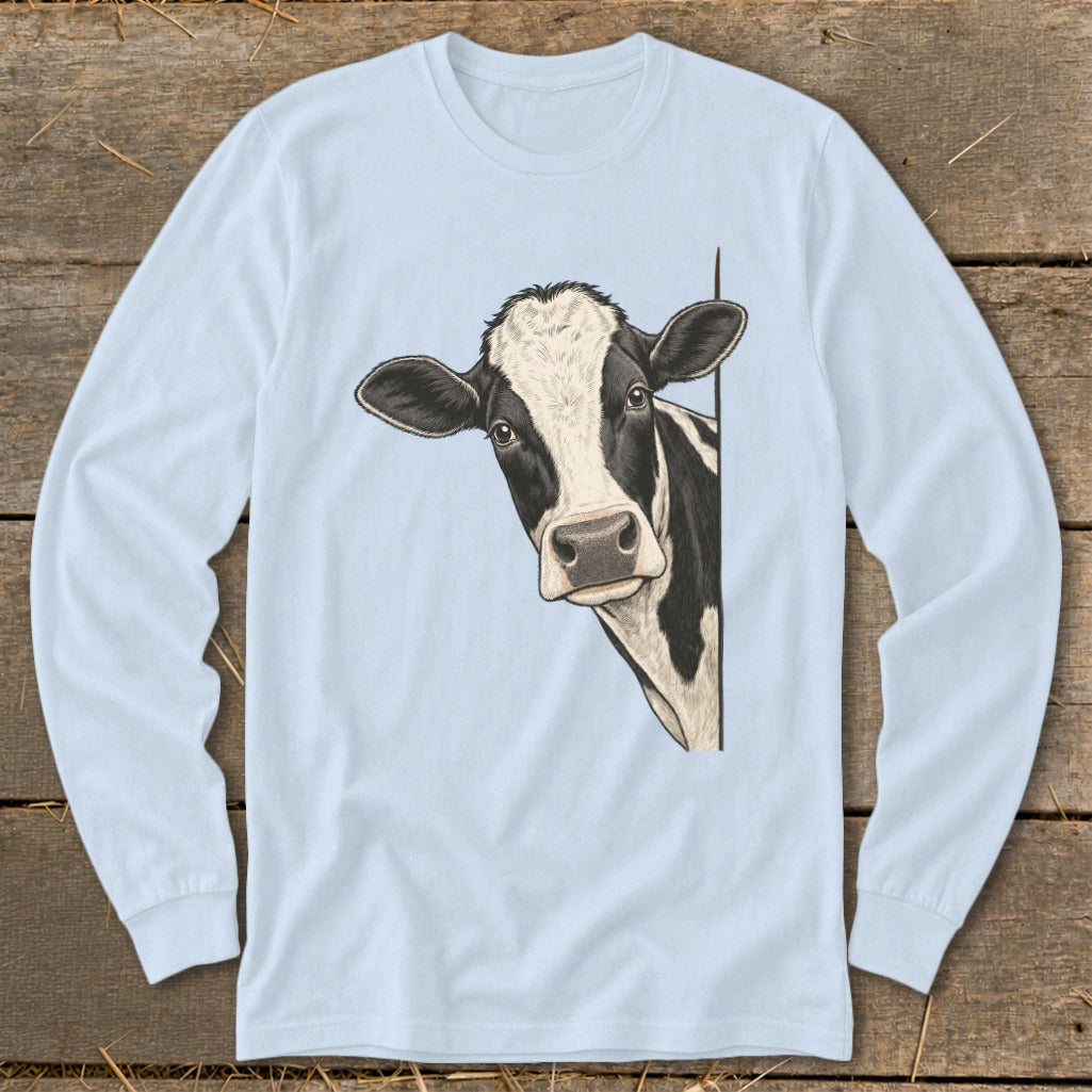Black and white cow peeking from the side on a light blue long-sleeve shirt.