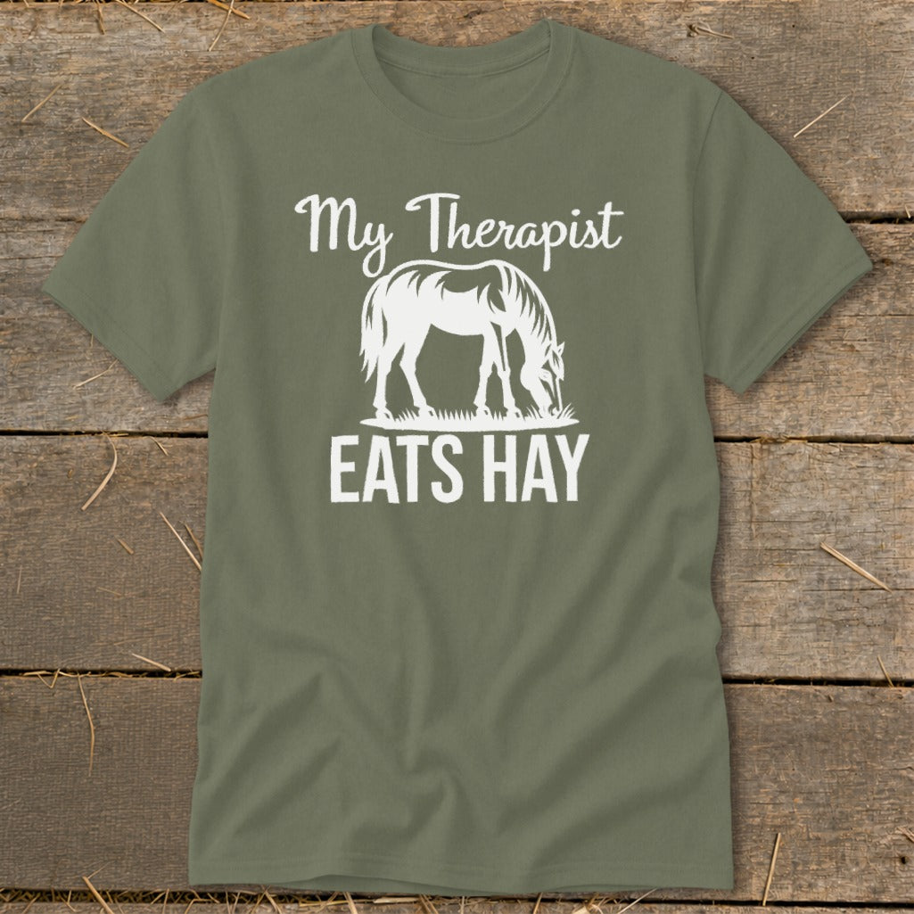 Green t-shirt with white text "My Therapist EATS HAY" and horse graphic.