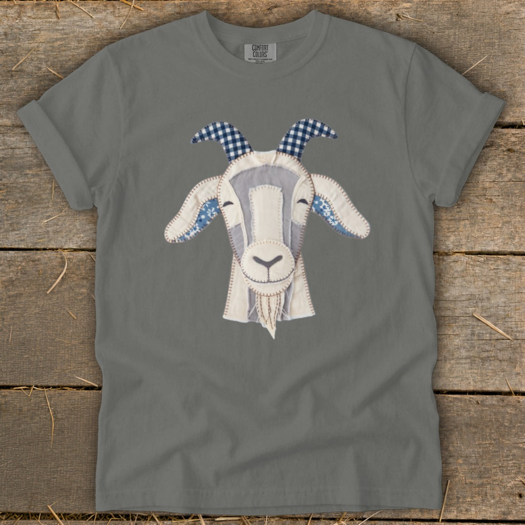 Grey t-shirt with a stitched applique goat face featuring gingham horns.