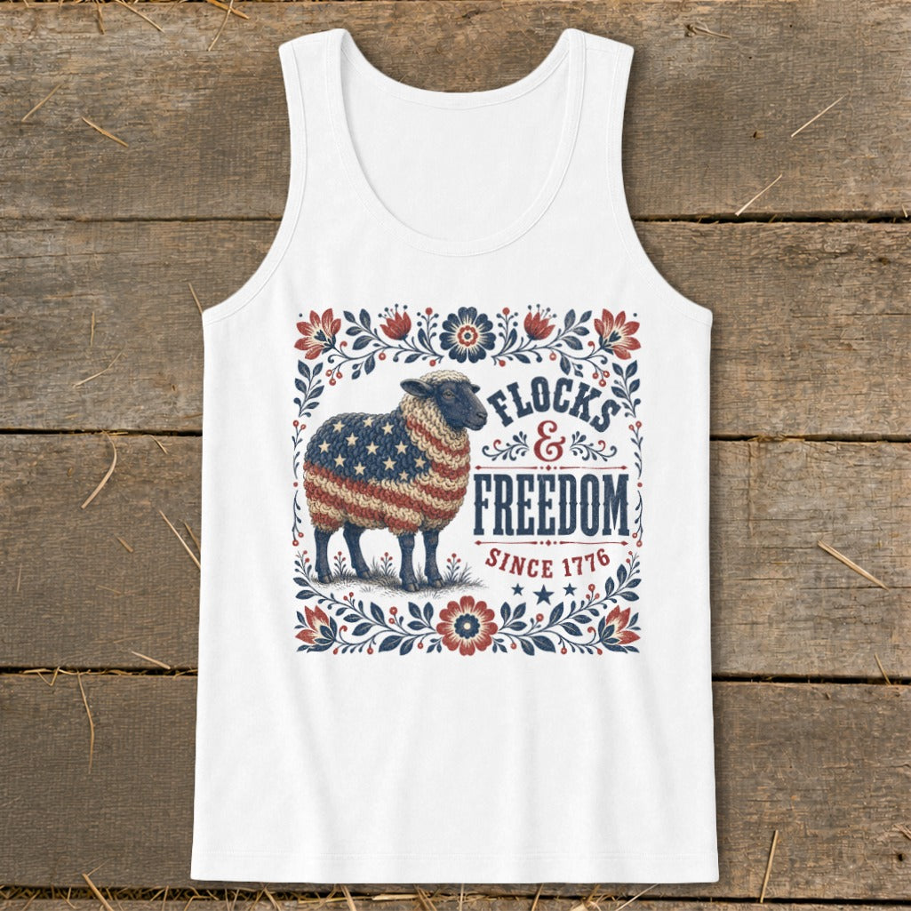 White tank top with sheep graphic, "Flocks & Freedom Since 1776" text, and floral border.