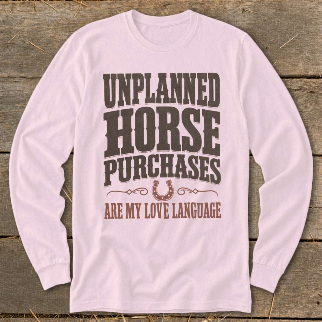 Pink long sleeve shirt with "Unplanned Horse Purchases Are My Love Language" text.
