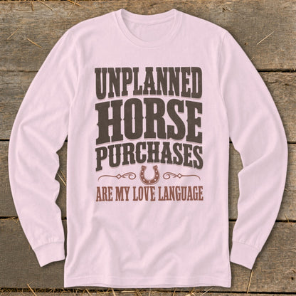 Pink long sleeve shirt with "Unplanned Horse Purchases Are My Love Language" text.