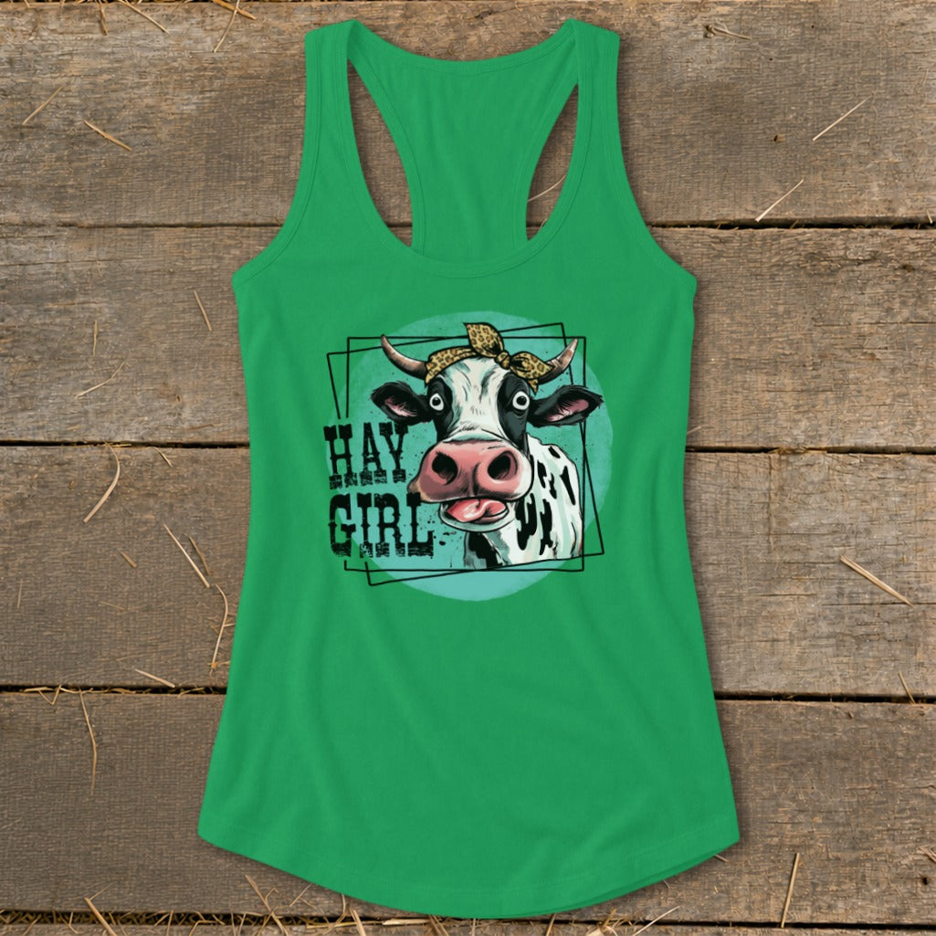 Green tank top with cartoon cow wearing a leopard print bandana and the text "Hay Girl".