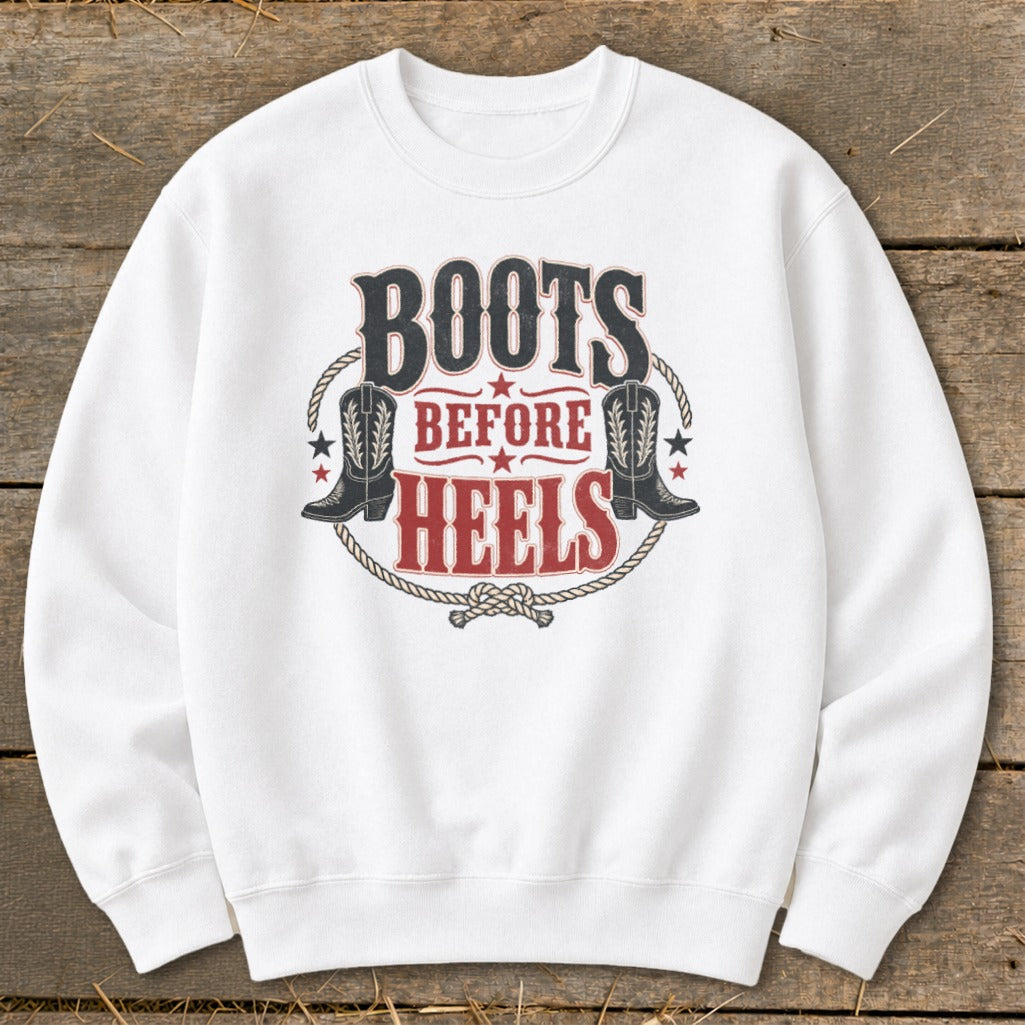 White sweatshirt with "Boots Before Heels" text and cowboy boot graphics.