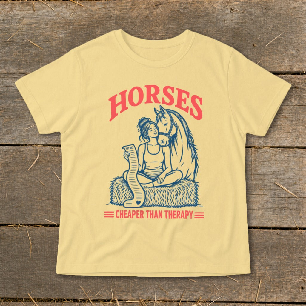 Yellow t-shirt with "HORSES Cheaper Than Therapy" graphic of a woman and horse.