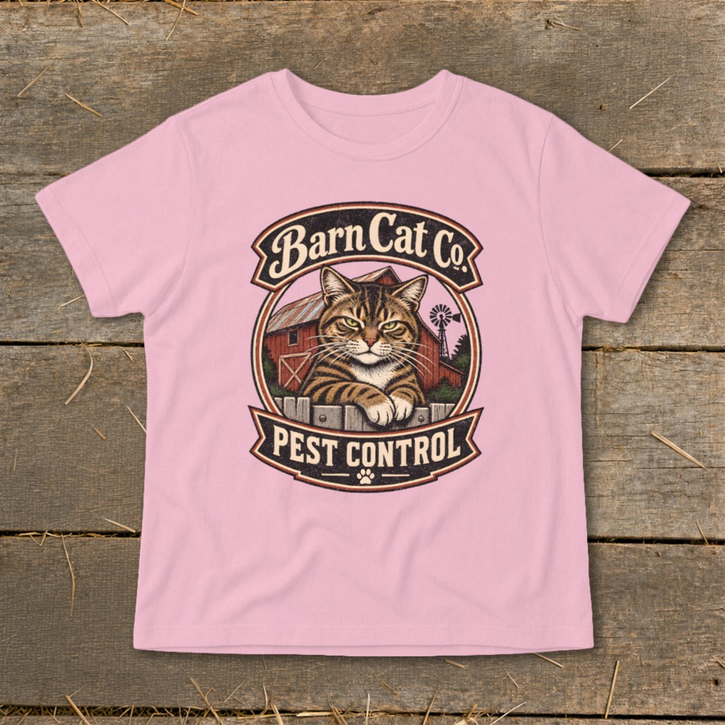A light pink t-shirt featuring a circular graphic of a tabby cat behind a fence with the text Barn Cat Co Pest Control.