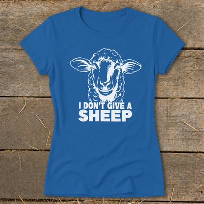 Blue t-shirt with white graphic of a sheep's head and text "I DON'T GIVE A SHEEP".