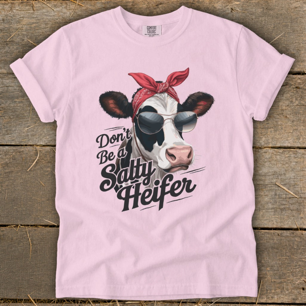 Pink t-shirt with a cow wearing sunglasses and a bandana that says "Don't Be a Salty Heifer."