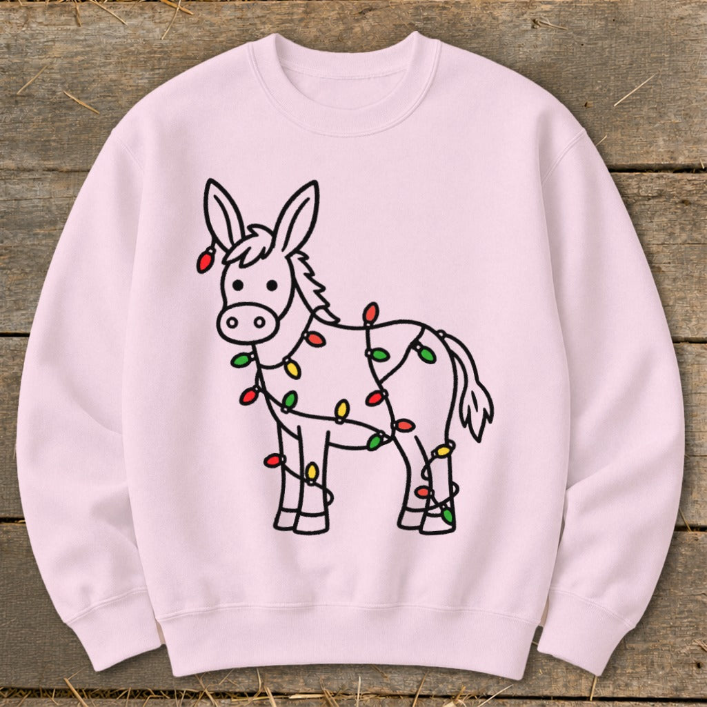 Pink crewneck sweatshirt with a cartoon donkey wrapped in Christmas lights.