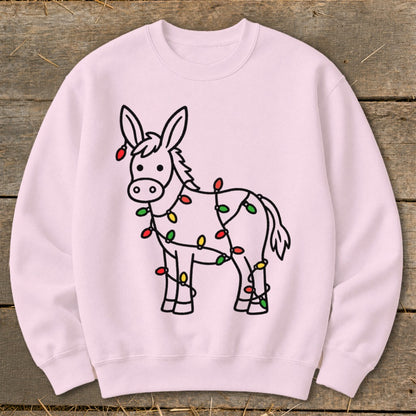 Pink crewneck sweatshirt with a cartoon donkey wrapped in Christmas lights.