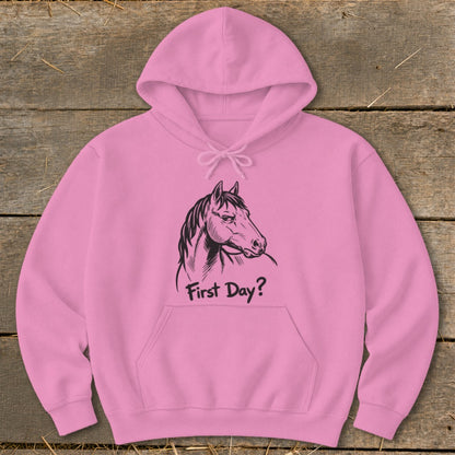 Pink hoodie with a black line drawing of a horse's head and the text "First Day?".
