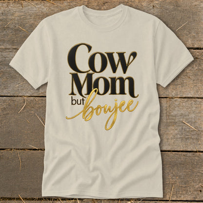 Cream t-shirt with "Cow Mom but boujee" text in gold and black lettering.