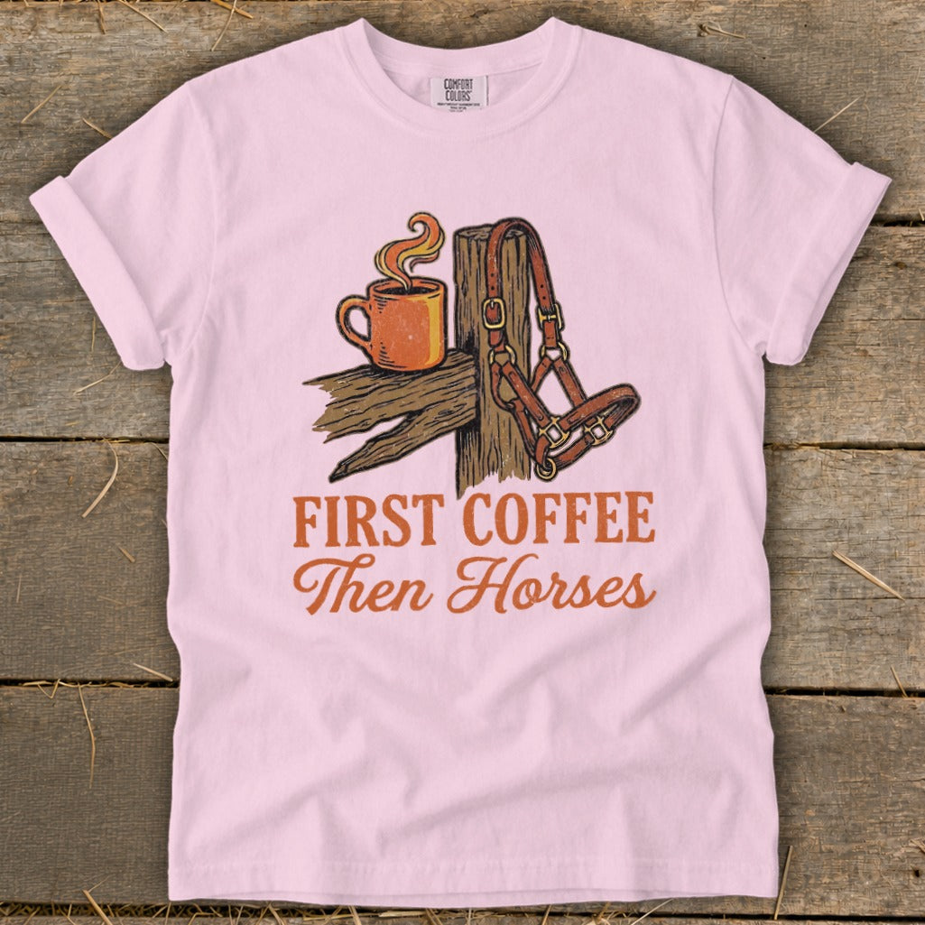 Pink t-shirt with "First Coffee Then Horses" text and horse halter.