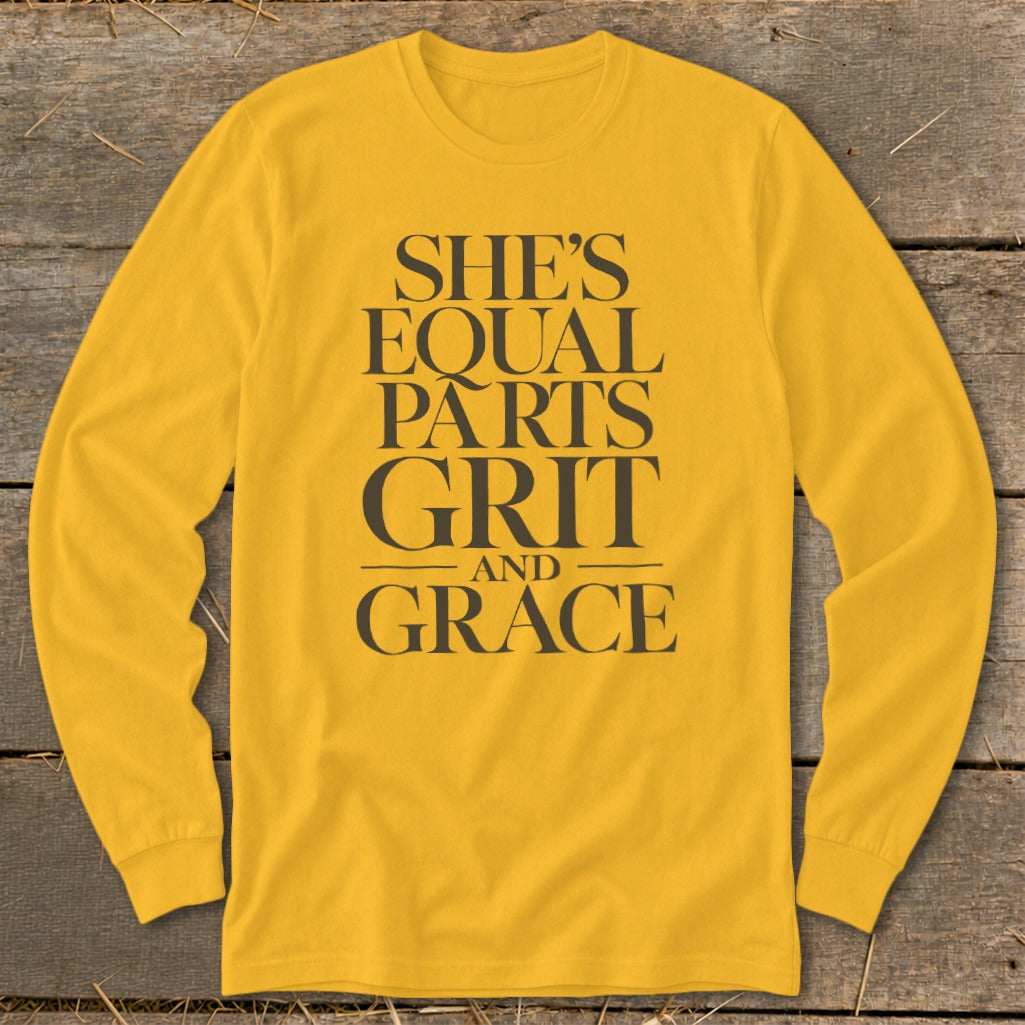 Yellow long sleeve shirt with "She's Equal Parts Grit and Grace" text.