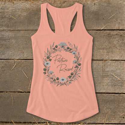 Peach tank top with floral wreath graphic and "Pasture Raised" text.