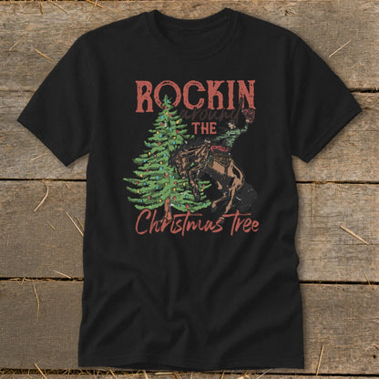 Black t-shirt with "Rockin Around The Christmas Tree" text and rodeo cowboy graphic.