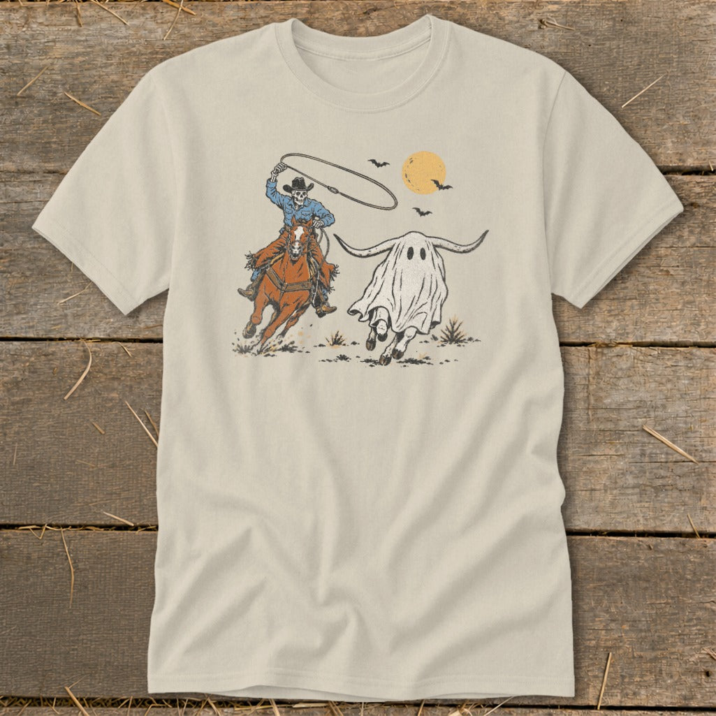 Skeleton cowboy on horse lassos a ghost with longhorns under a moon and bats.