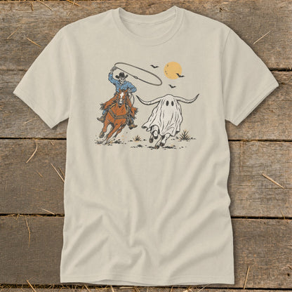 Skeleton cowboy on horse lassos a ghost with longhorns under a moon and bats.